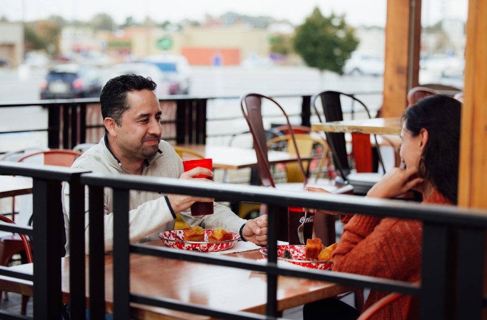 Couple dining on patio