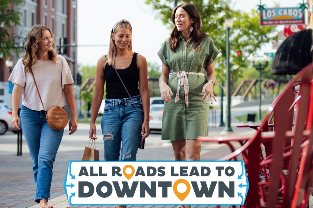 Three women walking downtown