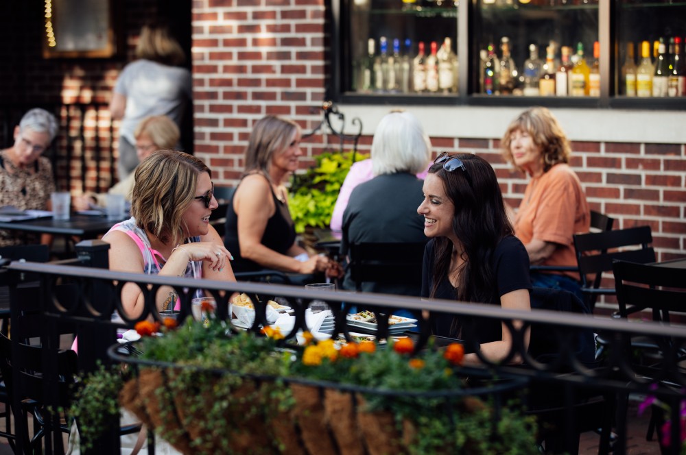 Ladies dining on a patio in downtown Cedar Falls