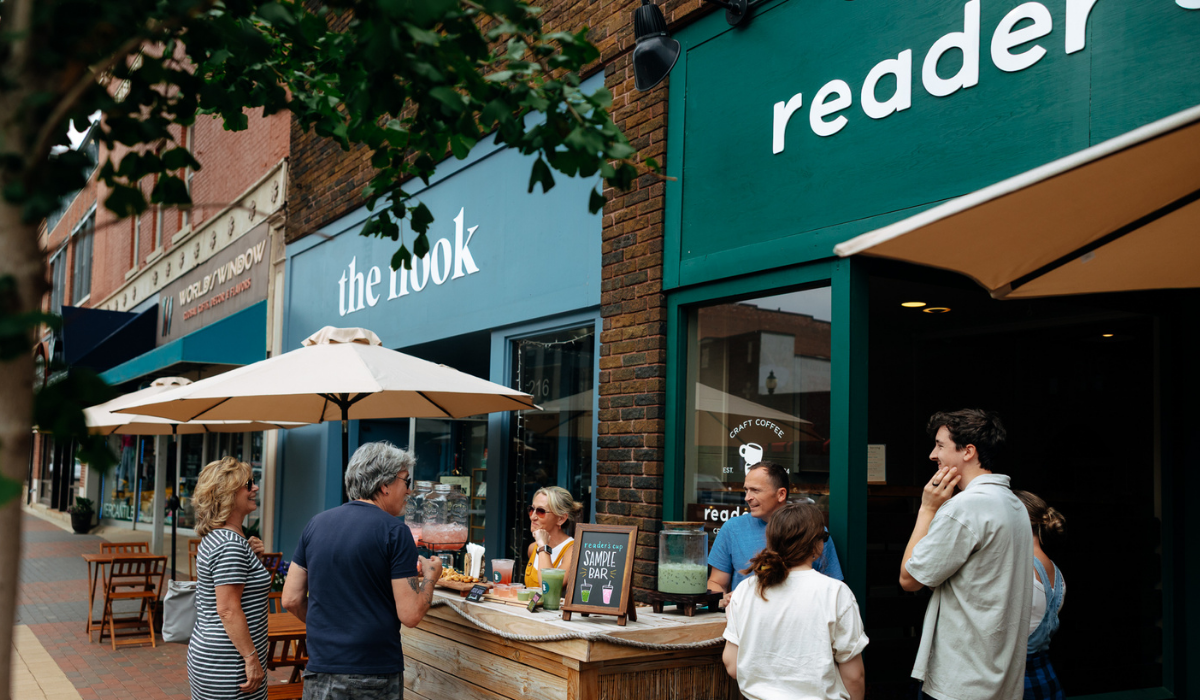 Street with several bookstores and people talking