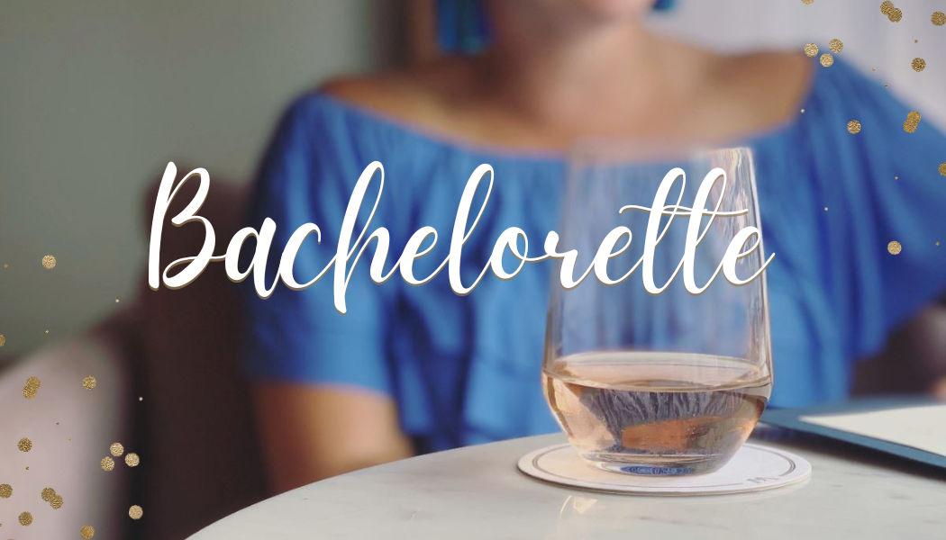 woman with glass of wine on table