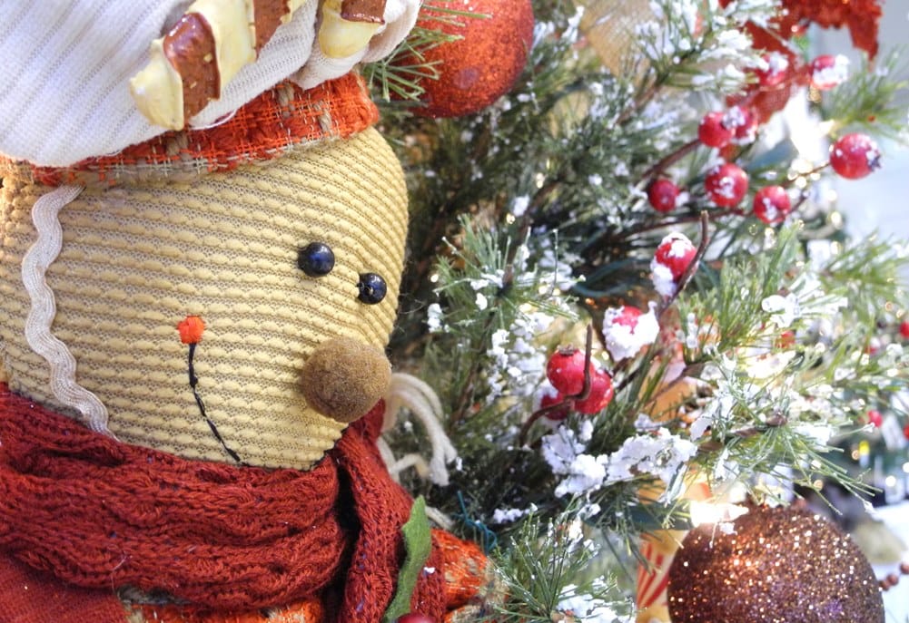 A gingerbread man peeks out of one of the trees in the Gallery of Trees at Sartori's Festival of Trees, November 15-20, 2016